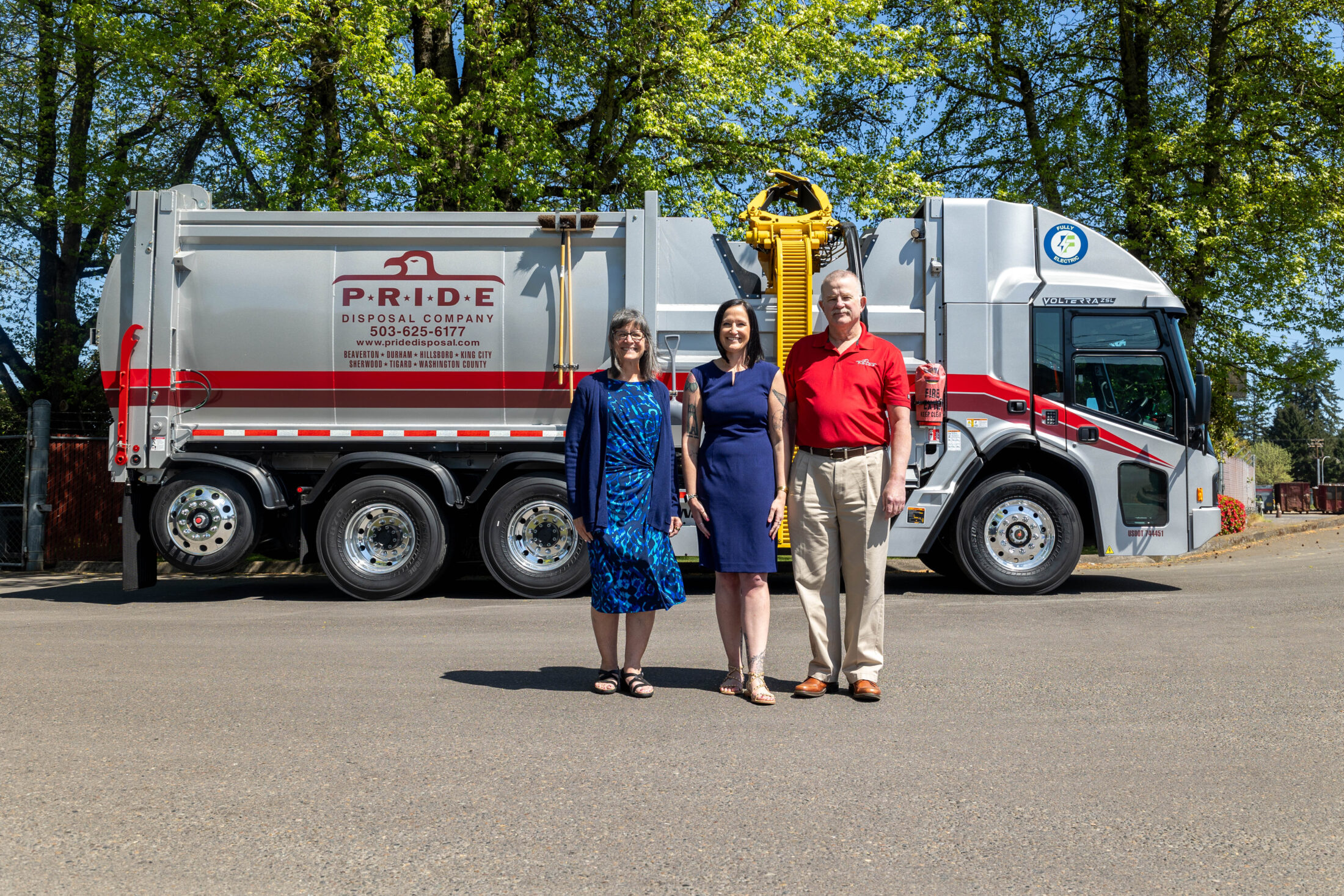 Pride's logo displayed on a garbage collection truck